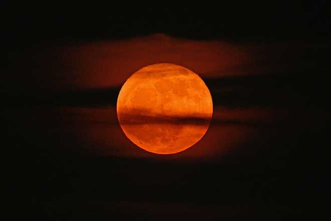 CHARLOTTE, USA - JUNE 11: Strawberry Moon over the Queen City in Charlotte NC, United States on June 11, 2025. (Photo by Peter Zay/Anadolu via Getty Images)