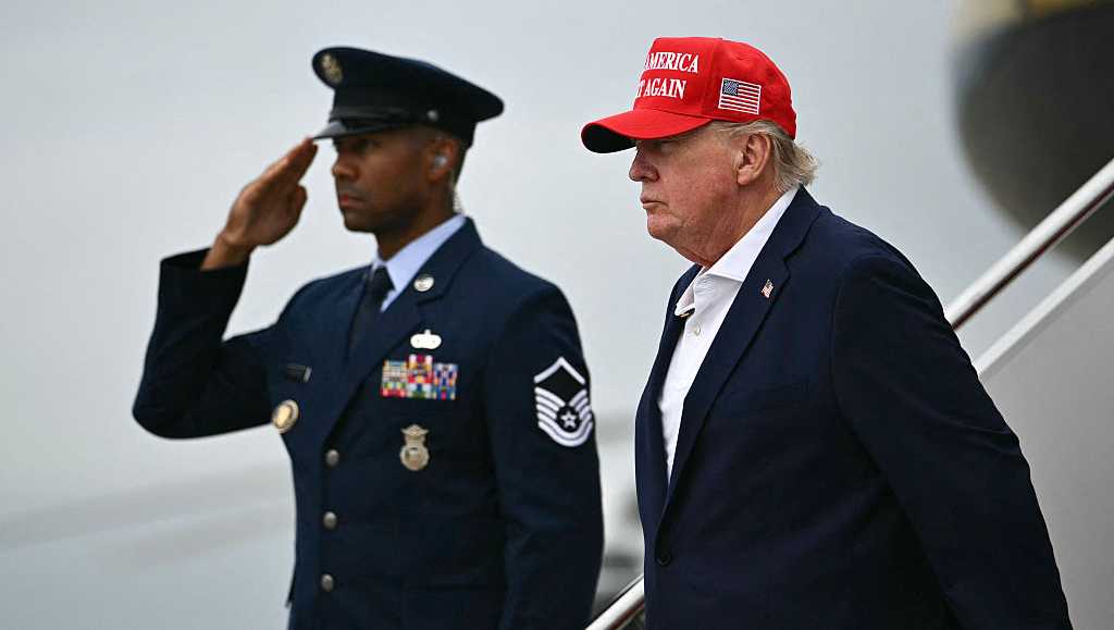 US President Donald Trump steps off Air Force One upon arrival at Joint Base Andrews in Maryland on August 16, 2026
