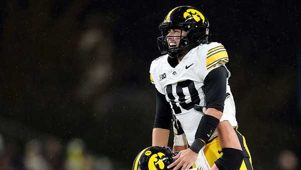 SEATTLE, WASHINGTON - OCTOBER 09: Jeremy Hecklinski #10 of the Iowa Hawkeyes celebrates a touchdown with Trevor Lauck #59 of the Iowa Hawkeyes during the first half against the Washington Huskies at Husky Stadium on October 09, 2026 in Seattle, Washington. (Photo by Steph Chambers/Getty Images)