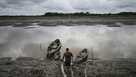 Fisherman walks to boat