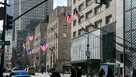 FILE - American flags wave in the wind on Fifth Avenue in the borough of Manhattan in New York City on Friday, Jan. 21, 2022. 
