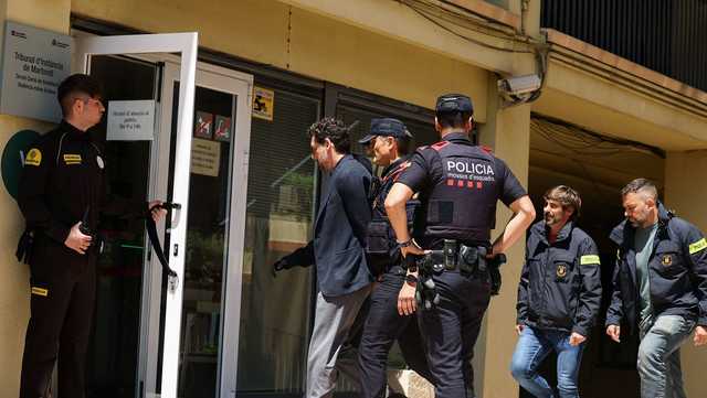 A fashion tycoon fell to his death during a hike. His son has been arrested in connection with his death