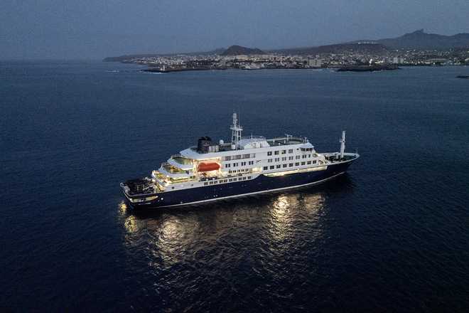A general view of the cruise ship MV Hondius, while stationary off the port of Praia, the capital of Cape Verde, on May 6, 2026. Two seriously ill crew members on a cruise ship stricken by a deadly hantavirus outbreak will be evacuated via Cape Verde to the Netherlands, allowing the vessel to sail on to Spain's Canary Islands, the ship operator said on May 5, 2026.
The MV Hondius has been at the centre of an international health scare since Saturday, when WHO was informed that the rare disease -- usually spread from infected rodents typically through urine, droppings and saliva -- was suspected of being behind the deaths of three of its passengers.
As others fell ill, passengers and crew have been in isolation after Cape Verde authorities barred the ship from docking, and as health authorities scrambled to find a port that would take the Hondius. (Photo by AFP via Getty Images)