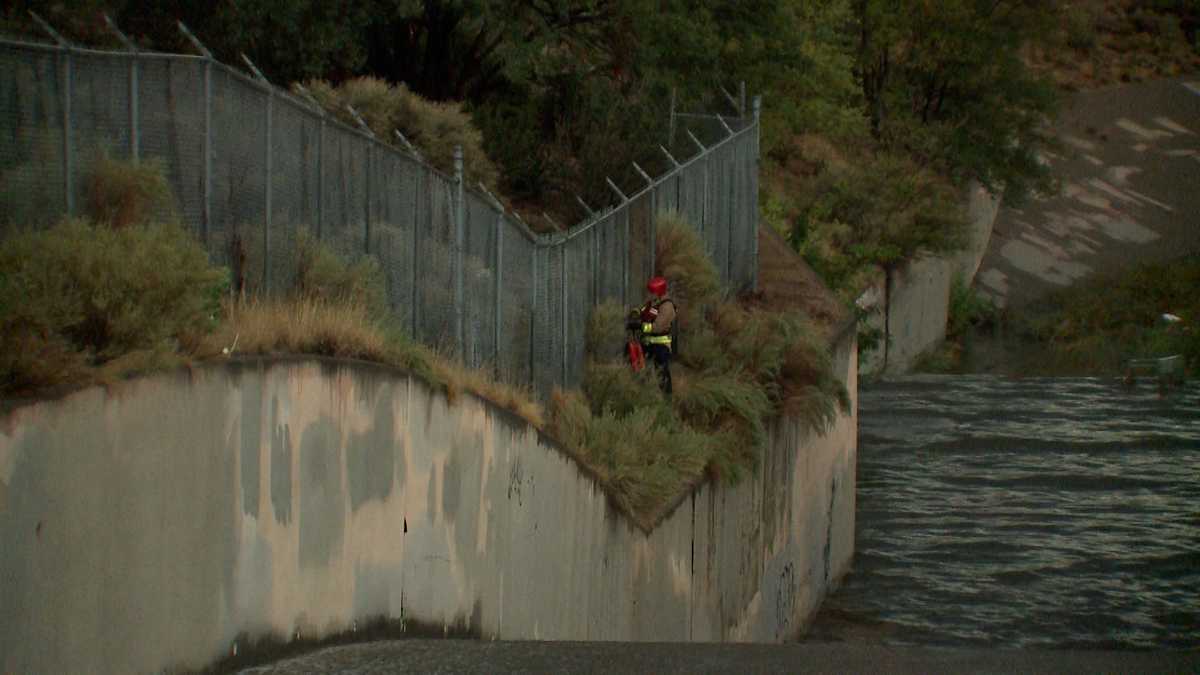 1 person rescued, crews search for second person swept away in Four Hills arroyo