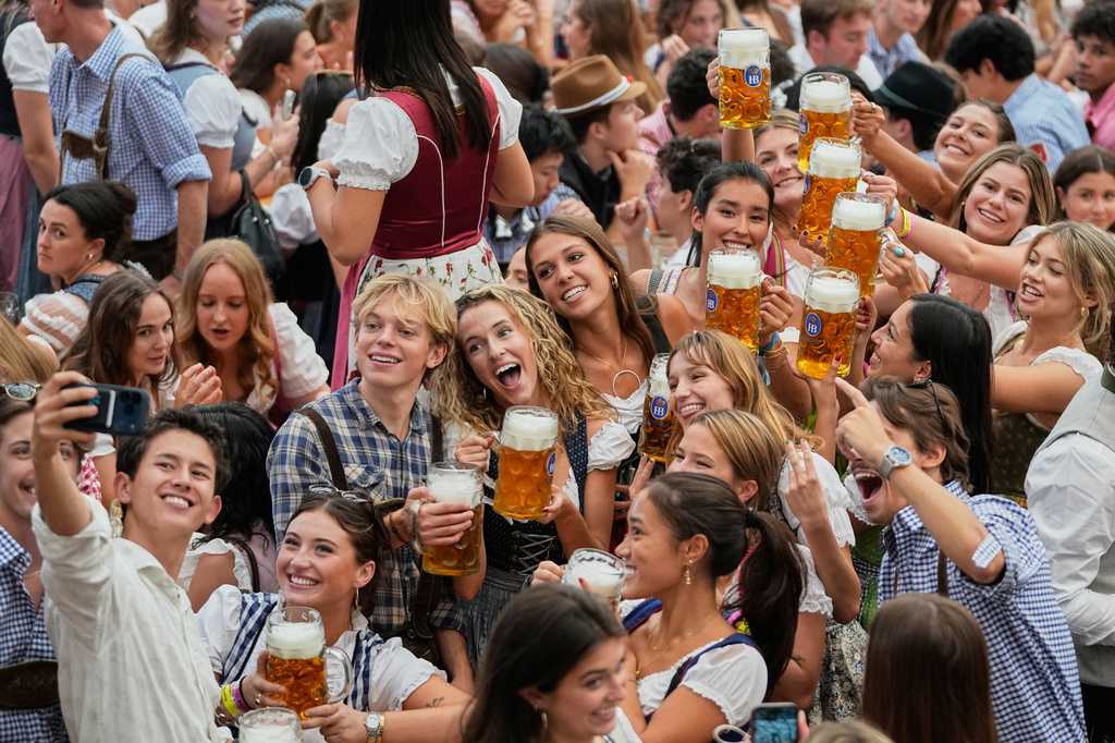 Munich’s Oktoberfest roars to life as the mayor taps the first keg