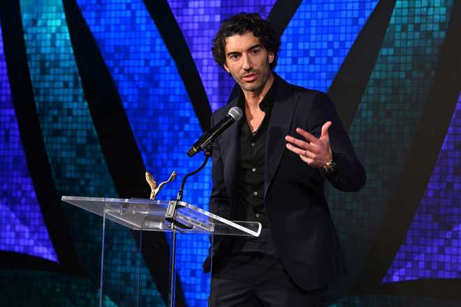 NEW YORK, NEW YORK - DECEMBER 09: Actor/filmmaker and VOS Honoree, Justin Baldoni speaks onstage at the Vital Voices 12th Annual Voices of Solidarity Awards at IAC Building on December 09, 2024 in New York City. (Photo by Bryan Bedder/Getty Images for  Vital Voices Global Partnership)