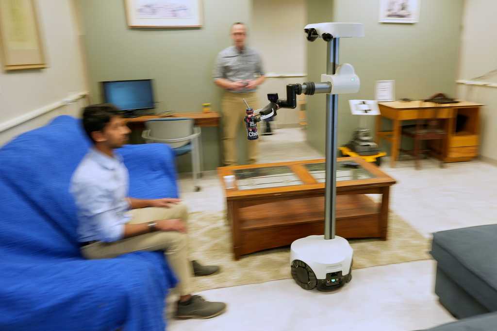 A robot is helping an ailing couple stay in their home. Are more to come for an aging population?