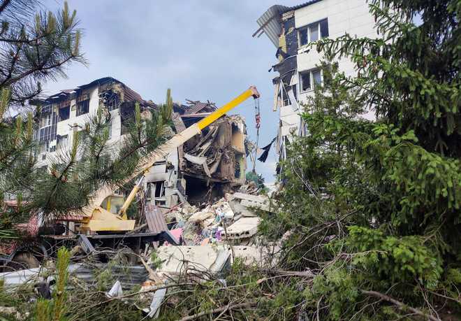 Rescuers work amid debris of a destroyed dormitory building of the Starobilsk College of Luhansk Pedagogical University following an overnight attack.