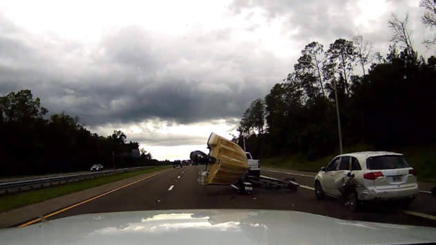 Video: Boat sent flying from trailer after crash on Florida highway