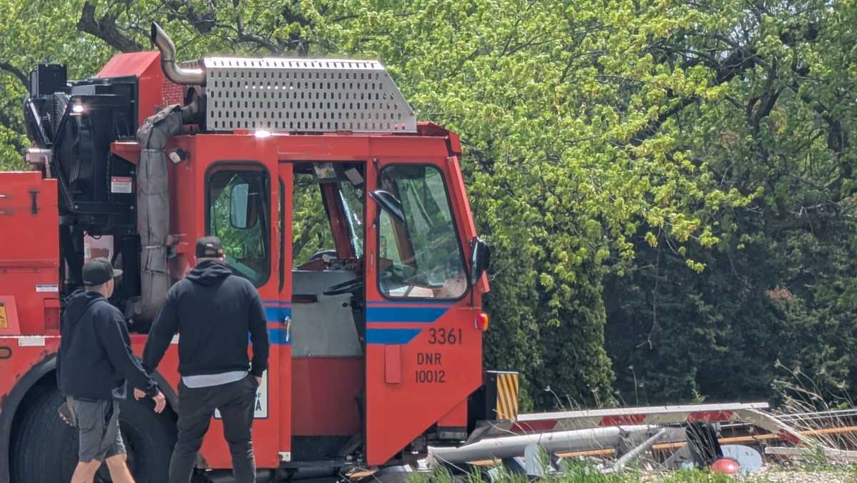Kenosha garbage truck hits railroad crossing arm after driver falls out of cab, police say