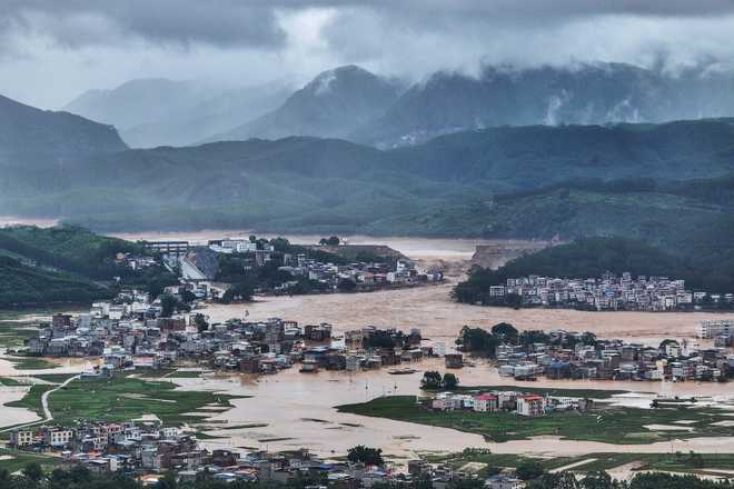 This photo released by Xinhua News Agency, shows flooded villages after the Liulan Reservoir breached due to heavy rains in Hengzhou, Nanning City, south China's Guangxi Zhuang Autonomous Region on Monday, July 6, 2026.