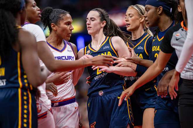 Alyssa Thomas #25 of the Phoenix Mercury and Caitlin Clark #22 of the Indiana Fever get into a scuffle during the game at Gainbridge Fieldhouse on June 22, 2026, in Indianapolis, Indiana.