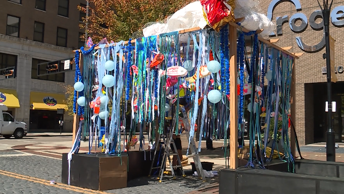 Covington mural glows with community-painted koi fish at BLINK festival