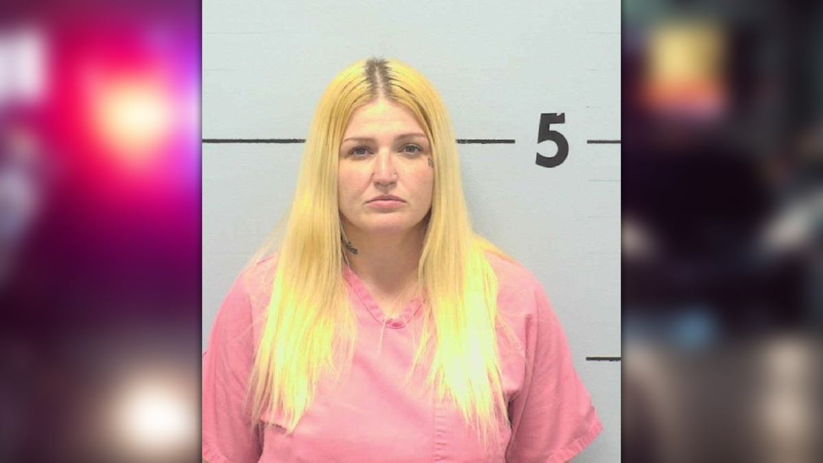 Woman arrested at gas station after shooting into occupied home, deputies say