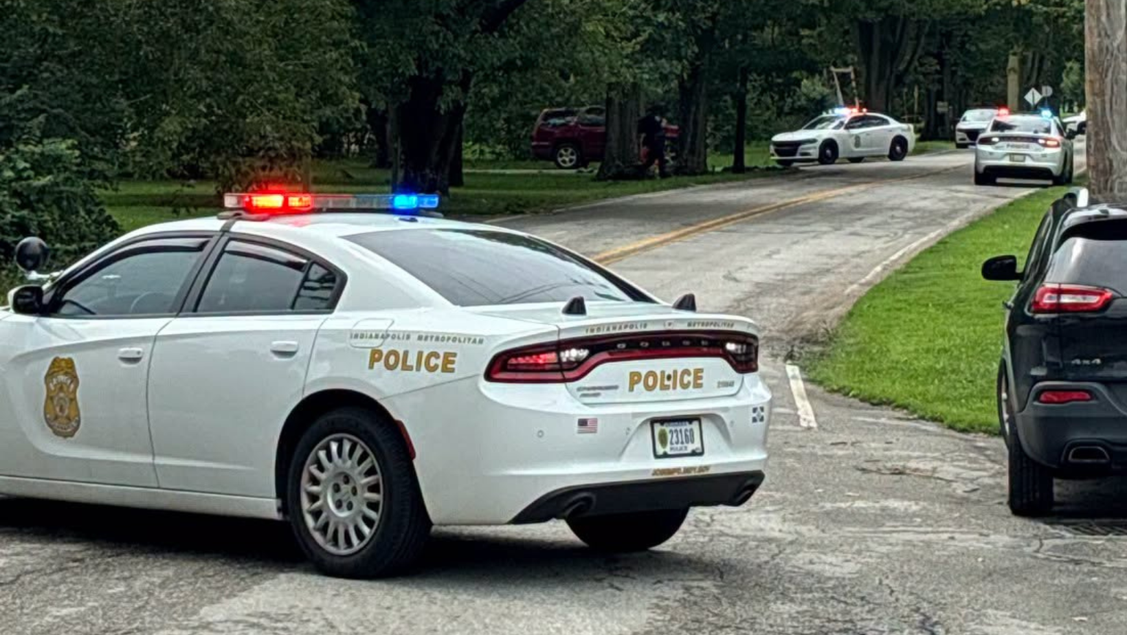 Two Indianapolis police officers and a suspect shot while serving narcotics warrant Friday; suspect barricaded himself, later surrendered, all in stable condition