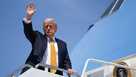 President Donald Trump waves as he boards Air Force One on May 12, 2026 at Joint Base Andrews, Maryland.