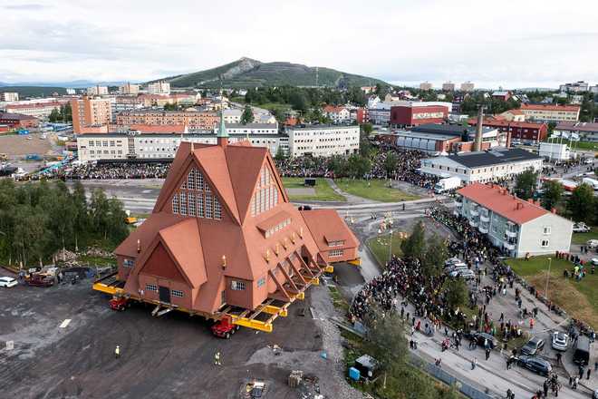 On a specially designed trolley with 224 wheels, Kiruna Church is moved at a speed of half a kilometer per hour during a relocation in Kiruna, Sweden, August 19, 2025.