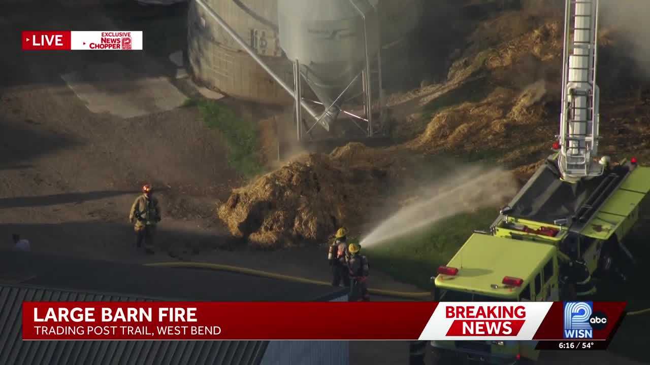 Dozen fire departments fight barn blaze at West Bend dairy farm - WISN