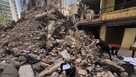 Workers search amongst the rubble of a destroyed building that was hit a week ago in an Israeli airstrike in central Beirut, Lebanon, Thursday, April 16, 2026. 