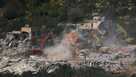 Israeli bulldozers demolish homes in southern Lebanon, as seen from northern Israel, Sunday, April 12, 2026.