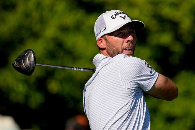 Sam Burns watches his tee shot on the 11th hole during the third round of the Masters golf tournament at the Augusta National Golf Club, Saturday, April 11, 2026, in Augusta, Ga.