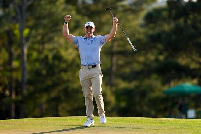 Rory McIlroy, of Northern Ireland, celebrates after winning the Masters golf tournament at the Augusta National Golf Club, Sunday, April 12, 2026, in Augusta, Ga.