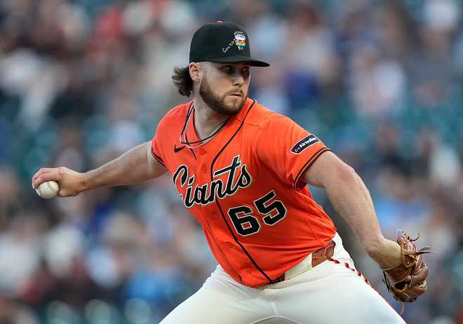 SAN FRANCISCO, CALIFORNIA - JUNE 12: Landen Roupp #65 of the San Francisco Giants pitches against the Chicago Cubs in the top of the first inning of a major league baseball game at Oracle Park on June 12, 2026 in San Francisco, California. (Photo by Thearon W. Henderson/Getty Images)