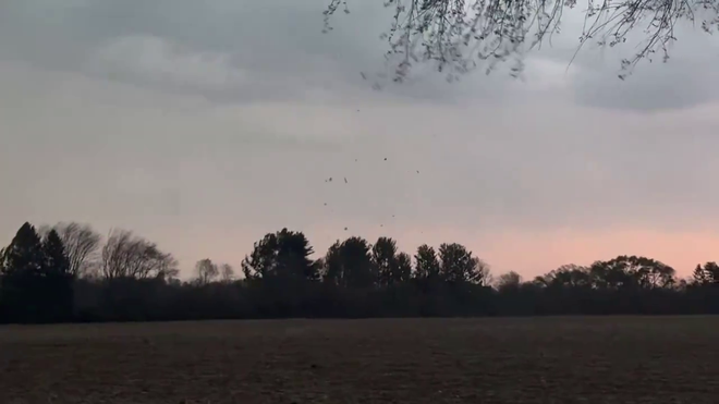 Debris flies through the air near Delavan