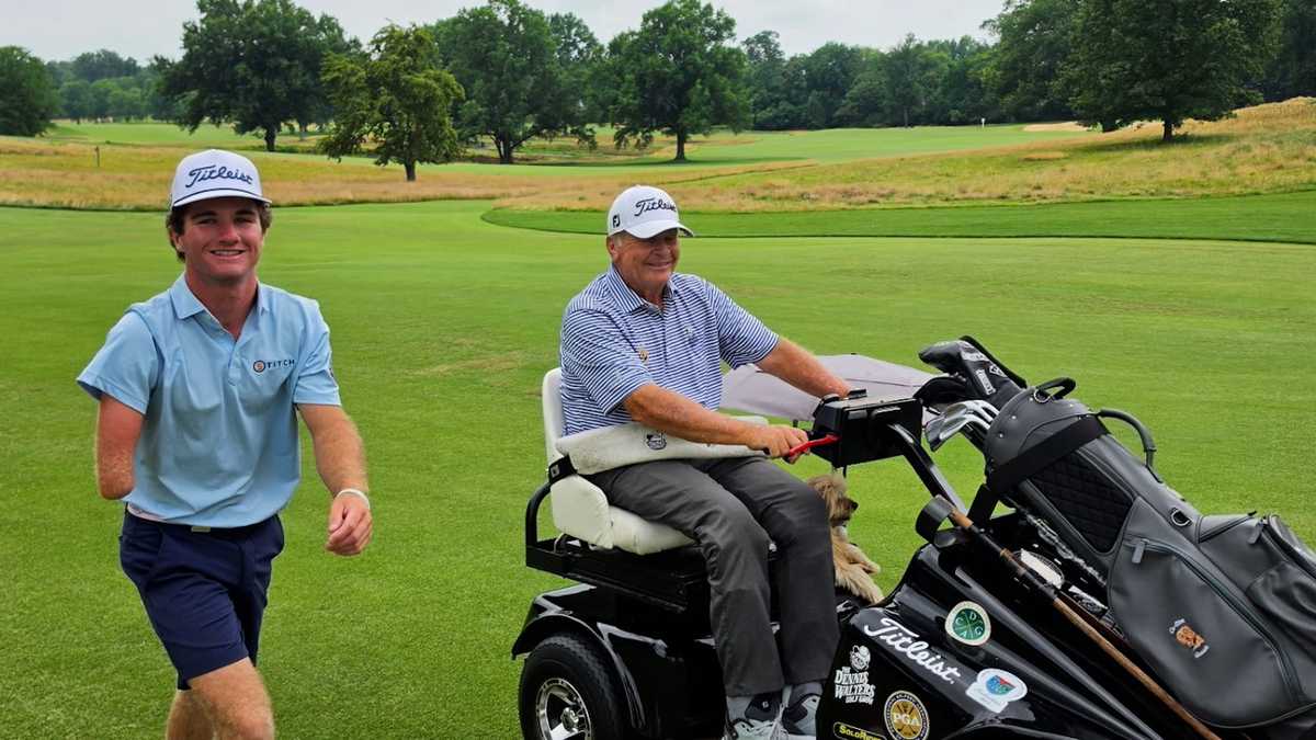 Tommy Morrissey and Dennis Walters on a golf course during the U.S. Adaptive Open