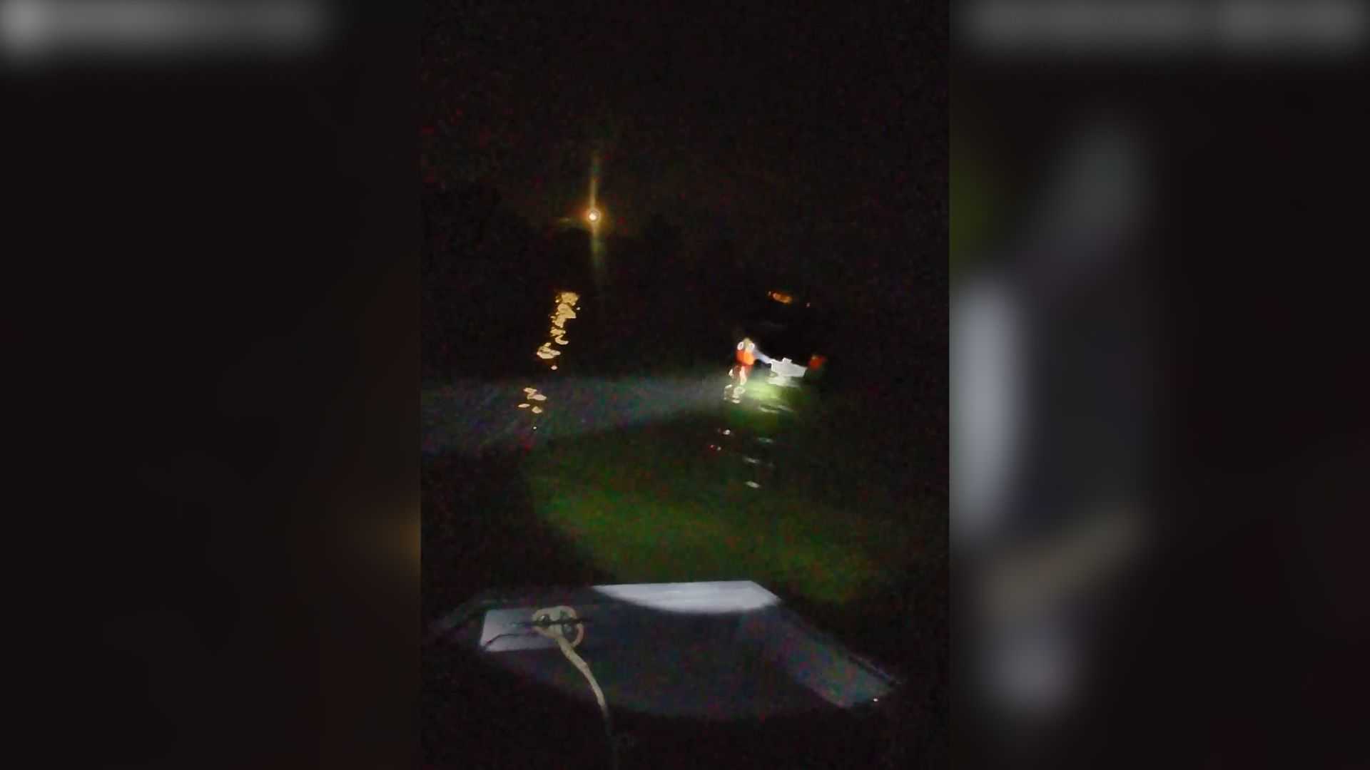Watch: Two men, one dog rescued from sinking boat on the North Shore