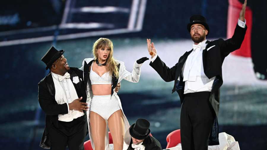 LONDON, ENGLAND - JUNE 23: (EDITORIAL USE ONLY. NO STANDALONE PUBLICATION USE (NO SPECIAL INTEREST OR SINGLE ARTIST PUBLICATION USE; NO BOOK USE)) EXCLUSIVE ACCESS. Taylor Swift is joined on stage by Travis Kelce (R), during "Taylor Swift | The Eras Tour" at Wembley Stadium on June 23, 2024 in London, England. (Photo by Gareth Cattermole/TAS24/Getty Images for TAS Rights Management )