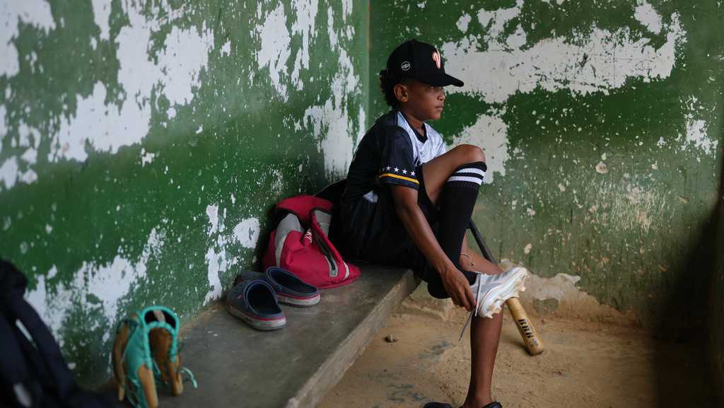 A 12-year-old baseball standout trains through tears after Venezuela quakes leave him homeless