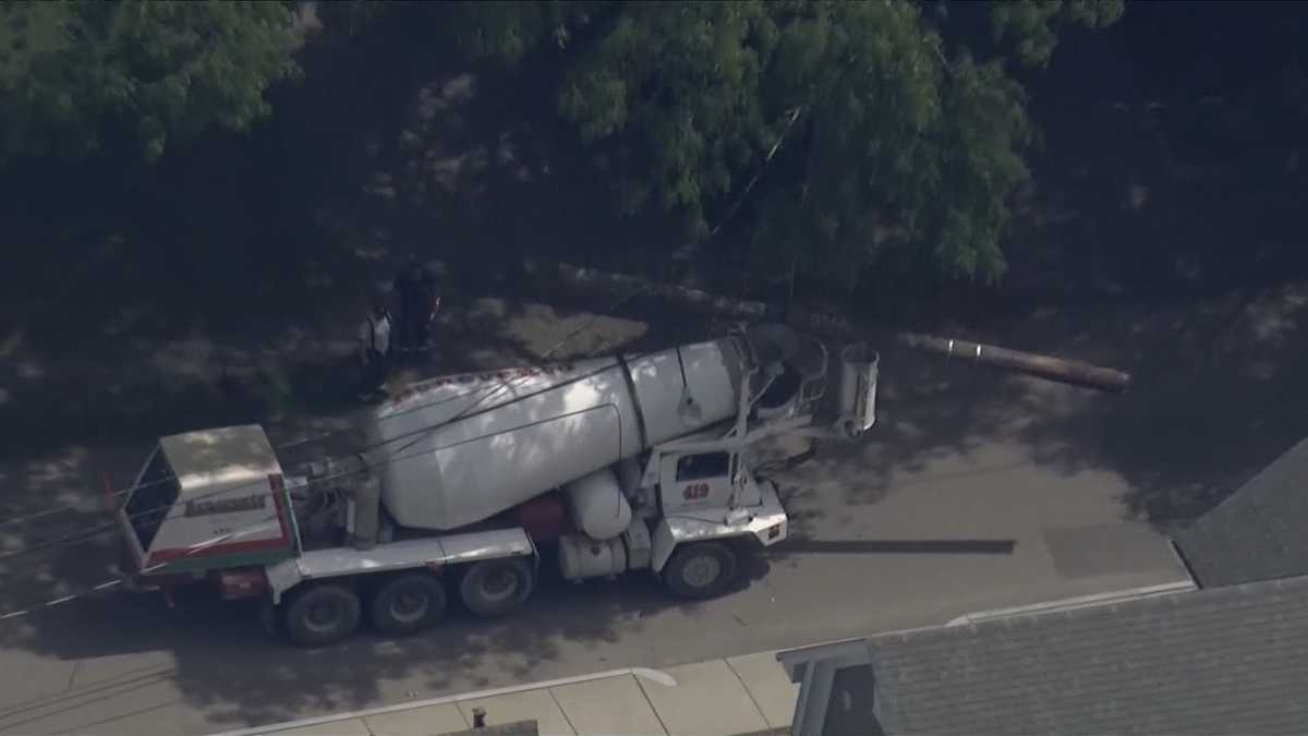 Truck crashes in Boston, knocking down several poles, prompting power outage