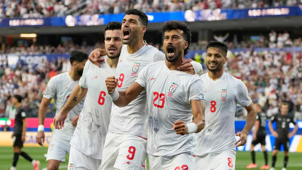 Iran opens its politically charged World Cup by playing to draw with New Zealand