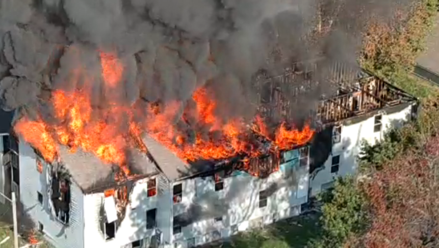 Photos show roof engulfed in flames at vacant Olive Street apartment building