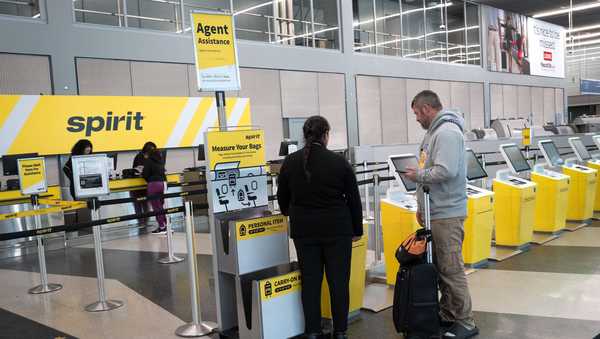 Passengers check in for Spirit Airlines flights in March at Chicago's O'Hare International Airport.