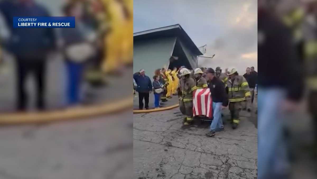 A somber moment: Watch as a firefighter's body is removed from the fire in Searsmont, Maine