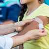 Doctors already have some flu vaccines as COVID shots lag behind