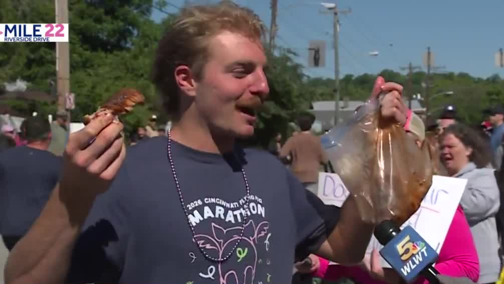 Flying Pig marathon runner eating rack of ribs while on the course. Here's why.