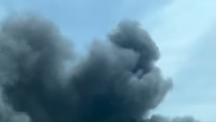 Fire reported near industrial area, several vehicles damaged, fire officials say