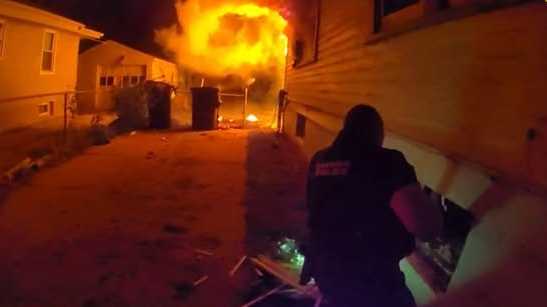 Photos: Omaha police officers jump into action to save child from house fire