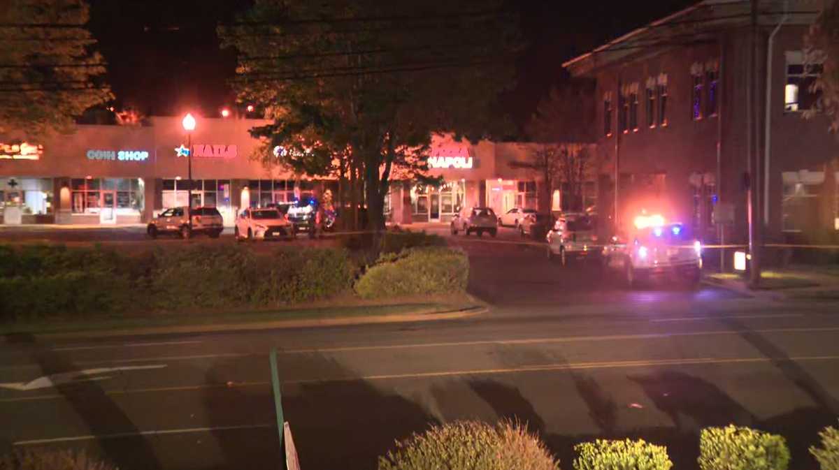 Man shot, killed by officers during shootout outside business, police say