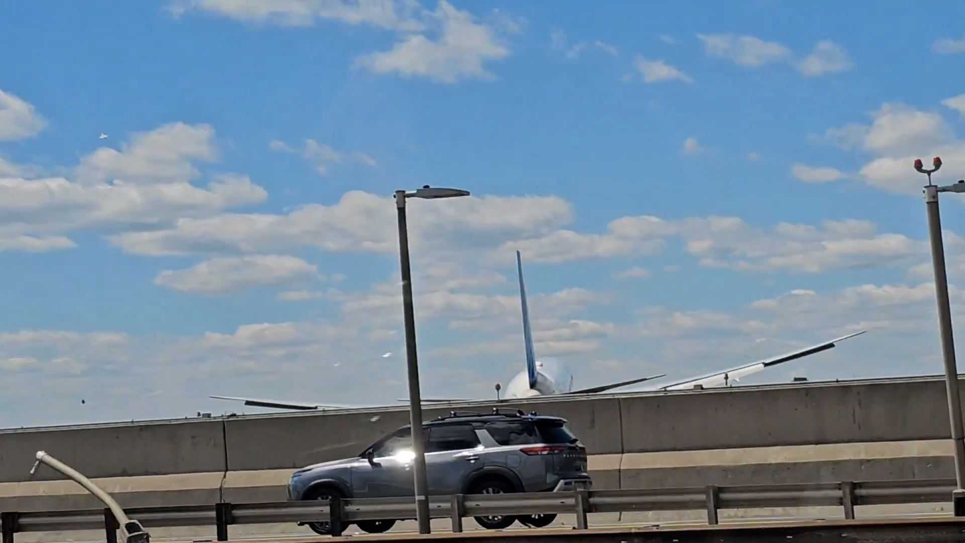 United flight was 19 feet above highway when it struck a pole as it was landing at Newark, NTSB says