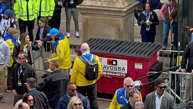 clintons wait for their daughter at the boston marathon