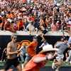 Oklahoma State fans storm field, throw goalpost into Theta Pond after upset win over Oregon