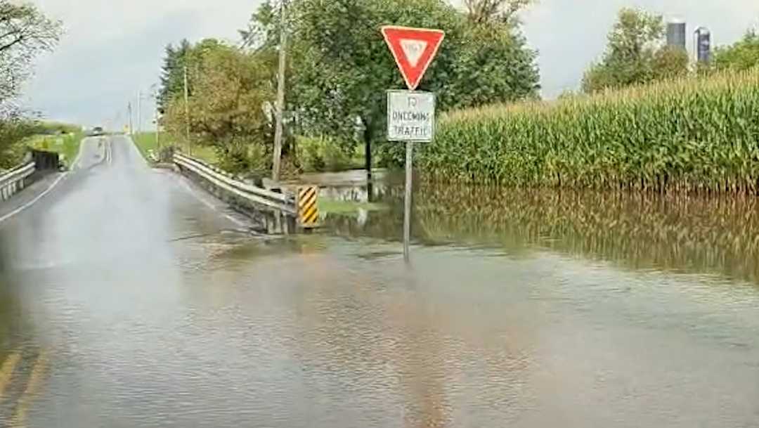 Floodwaters sweep across road at Pa . wildlife area