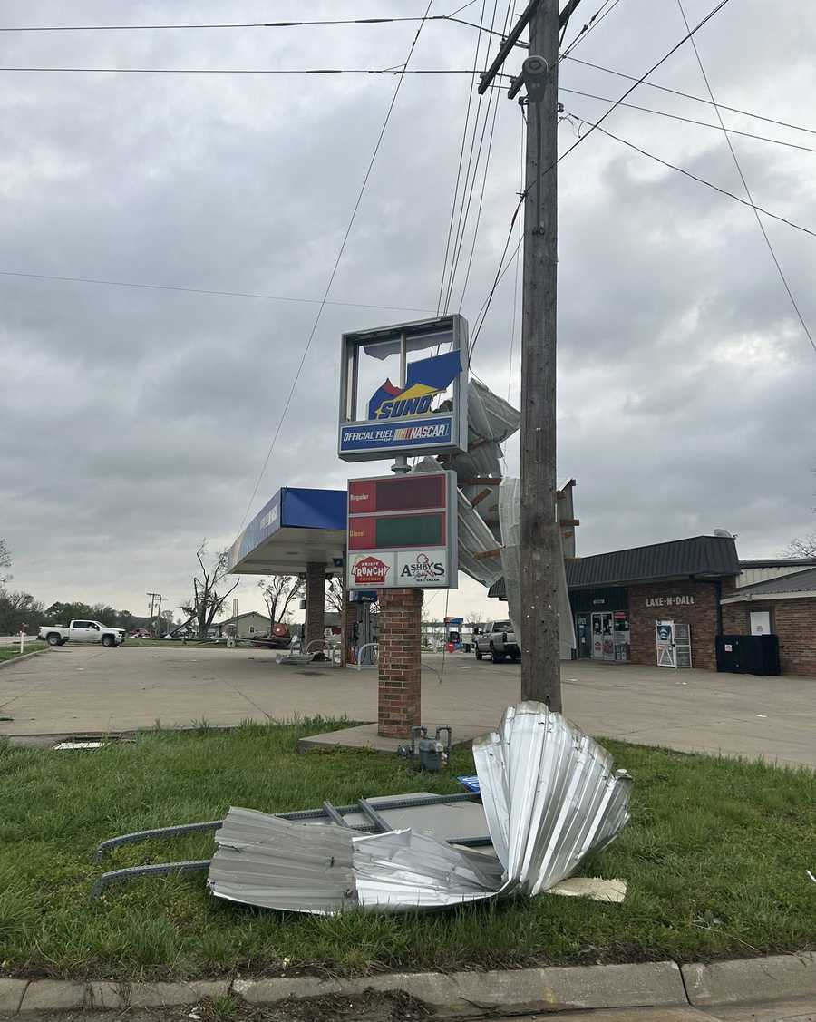 A sign is damaged in Hillsdale, Kansas, after a tornado-warned storm on April 13, 2026.