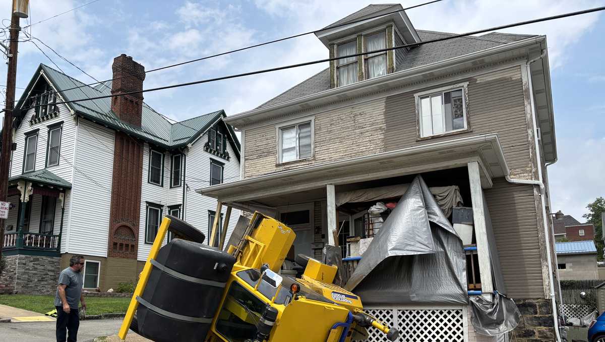 Greensburg street sweeper tips over after drifting backward, injuring driver