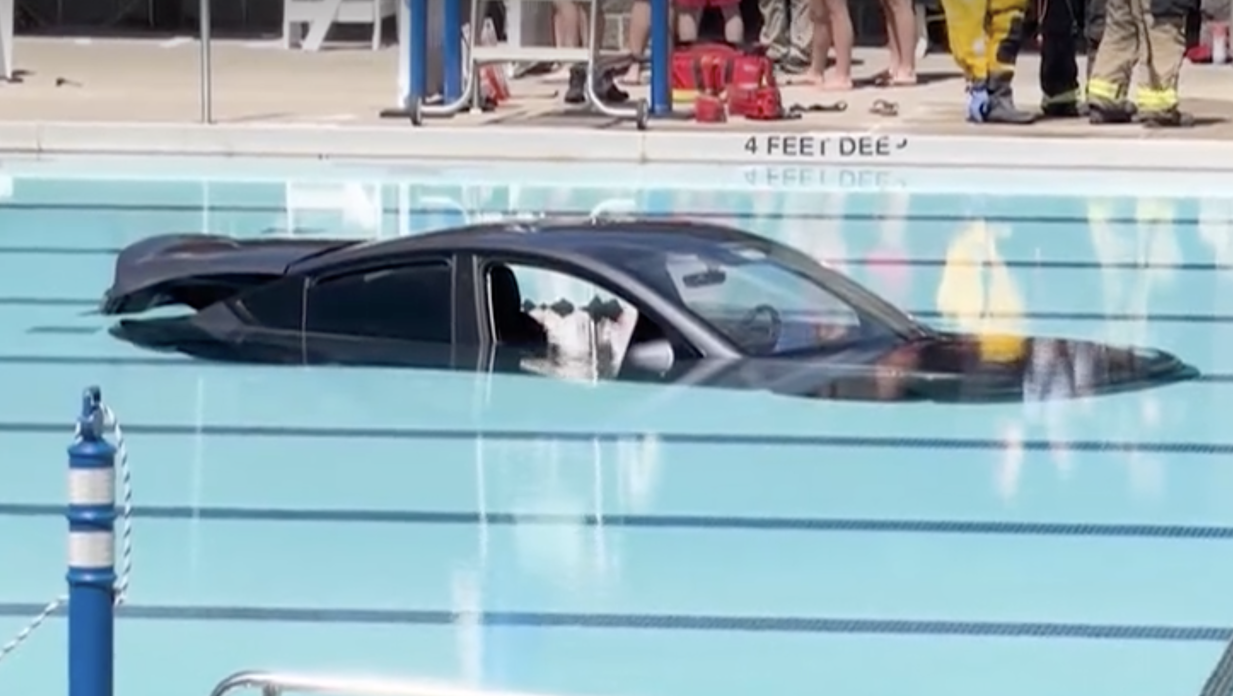 Man rescued after his car went into a public pool CNN