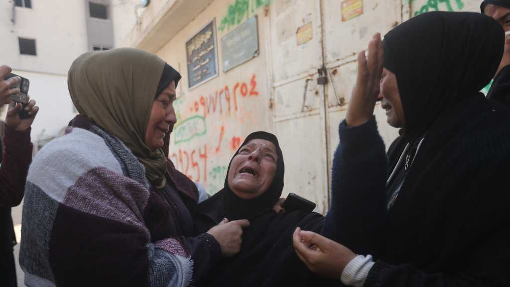 Palestinians hold funerals for pregnant woman, her children killed in Israeli strikes